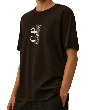Person wearing a CP Company t-shirt with a logo on a white background