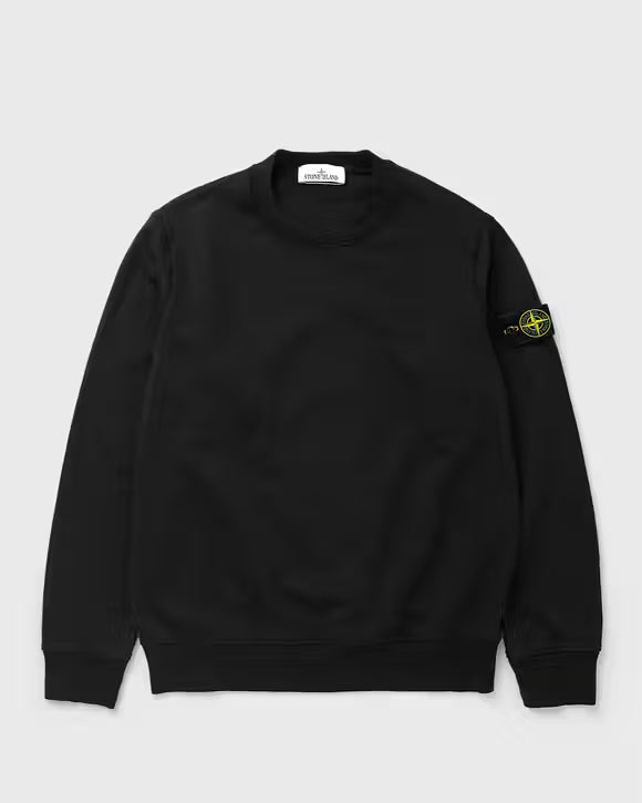 A black Stone Island crewneck sweatshirt with the signature compass badge on the left sleeve