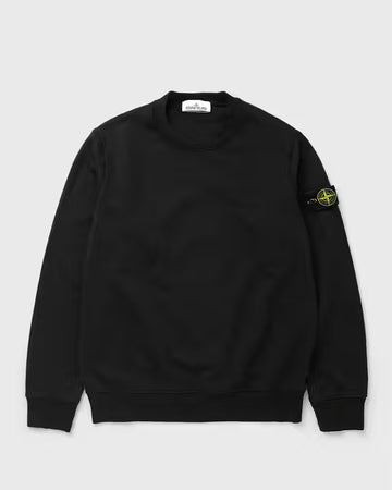 A black Stone Island crewneck sweatshirt with the signature compass badge on the left sleeve