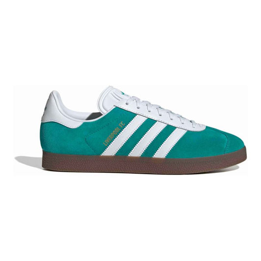 Green Adidas sneaker with white stripes on a white background