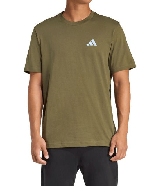 Person wearing an Adidas t-shirt on a white background