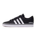 Black Adidas sneaker with white stripes on a white background