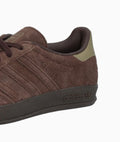 Brown Adidas sneaker on a white background
