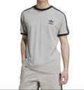 Person wearing a gray Adidas t-shirt with black accents on a white background
