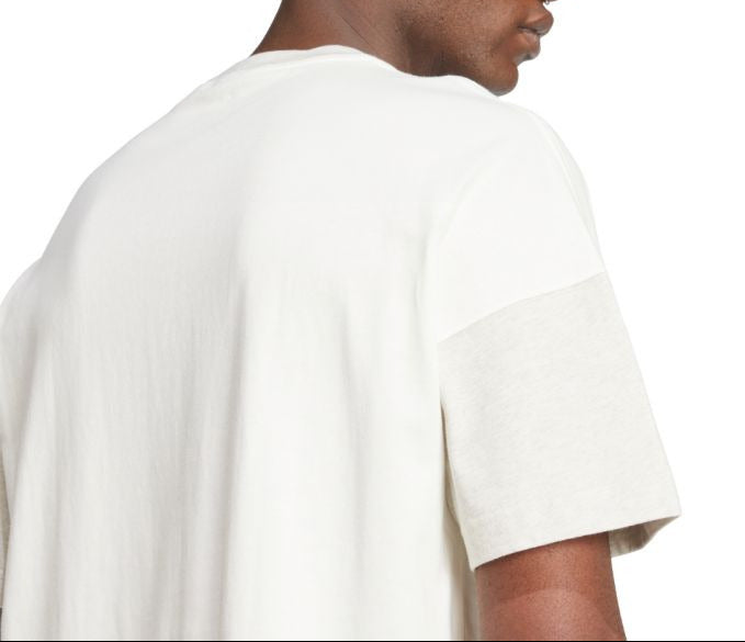 Man wearing a white t-shirt on a white background