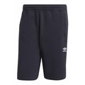 Black Adidas shorts on a white background