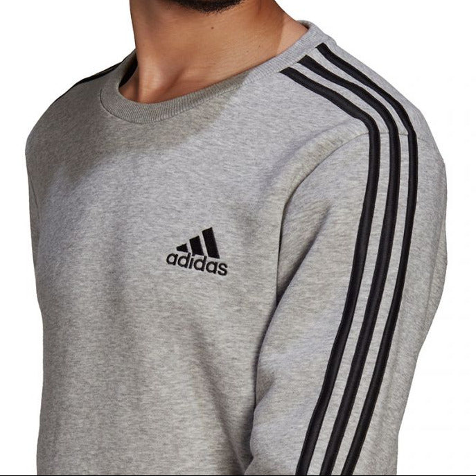 Gray Adidas sweatshirt with black stripes on a white background