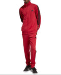 Person wearing a red Adidas tracksuit on a white background