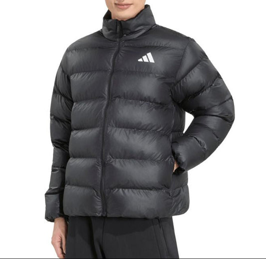 A man wearing a black Adidas puffer jacket with a white logo on the chest, photographed against a solid white background.