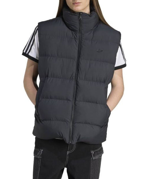Person wearing a black puffer vest with white stripes on a white background