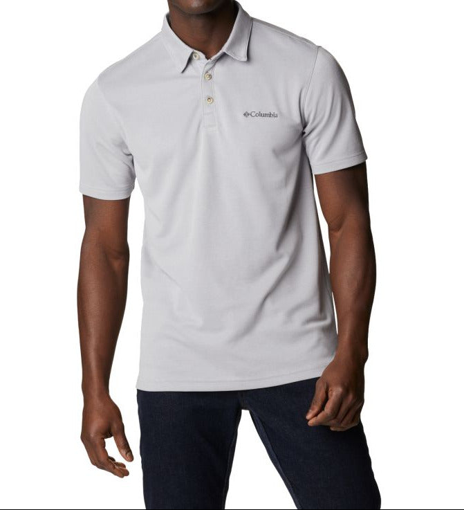 Man wearing a light gray polo shirt with Columbia logo on a white background