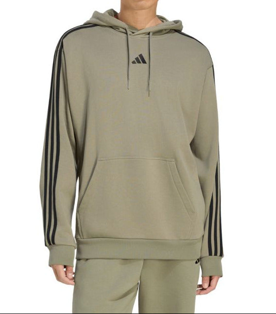 A model wearing an olive green Adidas hoodie with black three-stripes on the sleeves and a black logo on the chest, paired with matching olive green sweatpants, against a plain white background.