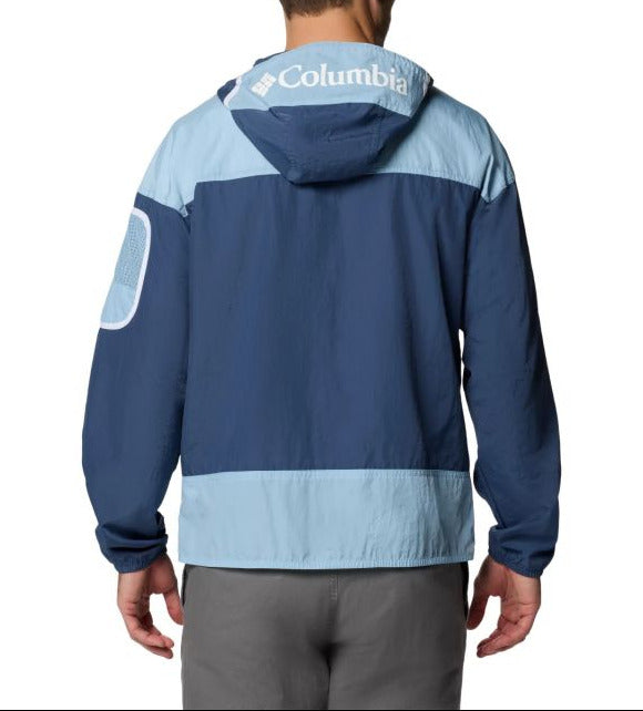 Person wearing a blue and light blue Columbia jacket on a white background