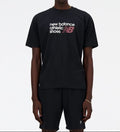 Person wearing a black New Balance t-shirt on a white background