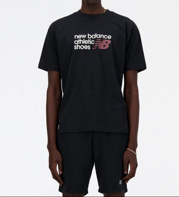 Person wearing a black New Balance t-shirt on a white background